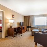 Comfort Inn & Suites Rocklin - Roseville king suite living room with bedroom view