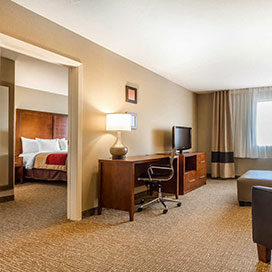 King-Two-Room-Suite king bed in two room suite