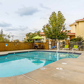 outdoor pool with chairlift and loung chairs